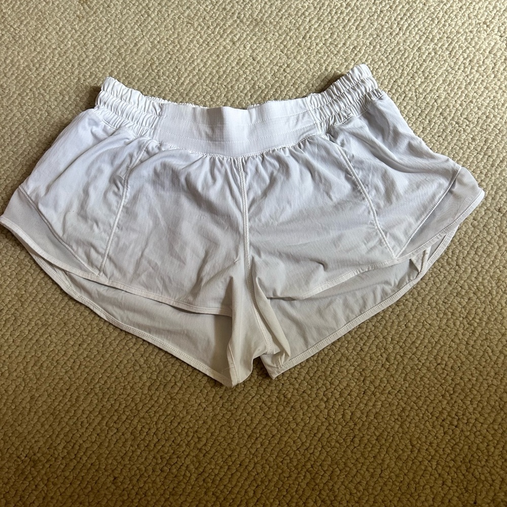 White lululemon hotty hot shorts 
size 8
nude liner
